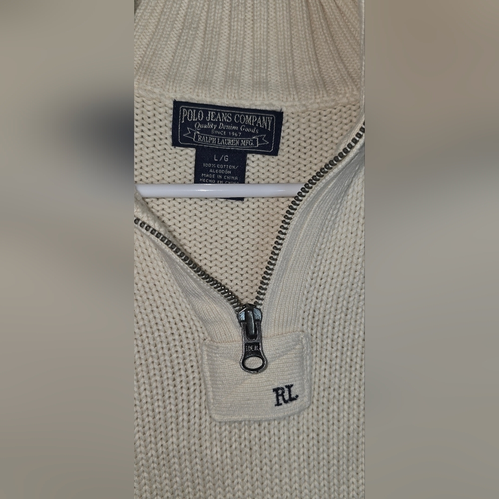 This Polo Ralph Lauren Knit Sweater in red is a stylish and versatile addition t